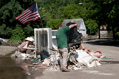 After floodwaters recede, there are laws and guidlines for disposing of damaged household items such as appliances. (FEMA photo)